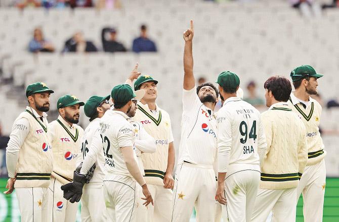 Pakistani bowler Amir Jamal thanking the above after taking the wicket. Photo: PTI