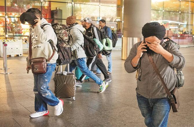 Passengers returning from France at Mumbai Airport. Photo: PTI