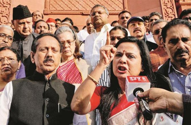 Mahua Moitra protesting with opposition members in the Parliament premises. Photo: PTI