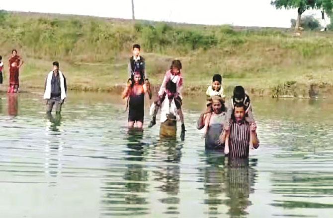 People cross the river themselves daily because of their children