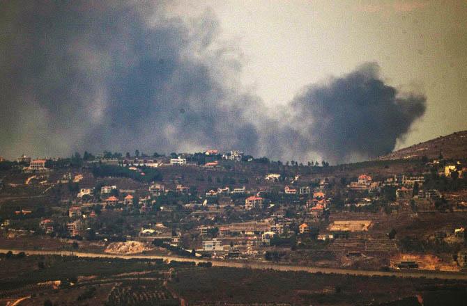 After Israel`s attack, smoke is rising from Lebanon. Photo: AP/PTI