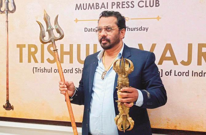 Syed Shah Mir Hussain showing the discovered Trishul and Vajra. Photo: INN