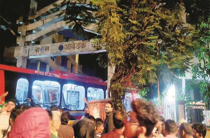 The bus and the crowd after the accident. Picture: INN