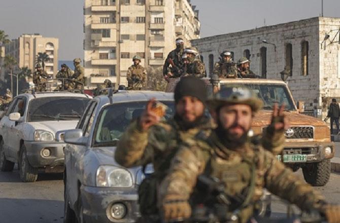 Rebel groups entering Syrian cities. Photo: PTI