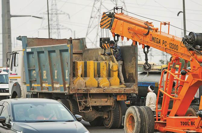 Police are erecting roadblocks around Delhi to prevent farmers from entering the capital. Photo: PTI