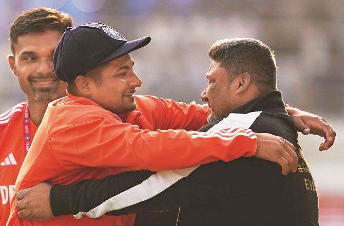 Sarfaraz Khan hugging his father Naushad Khan. Photo: PTI