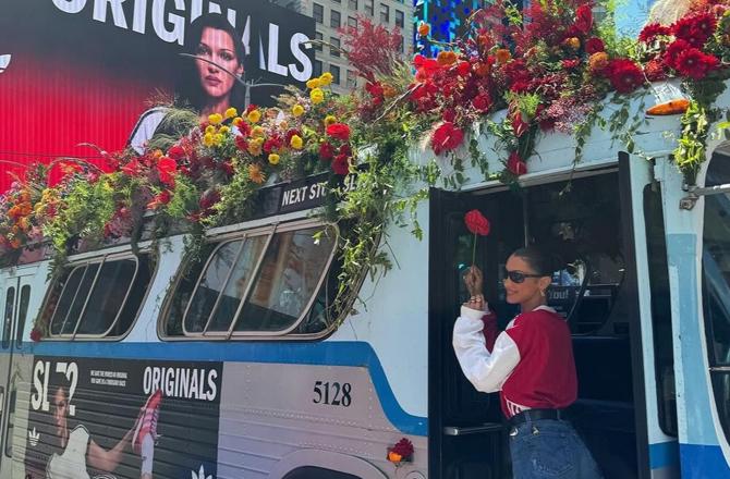 Bella Hadid in Adidas ad on Times Square billboard and bus. Image: X