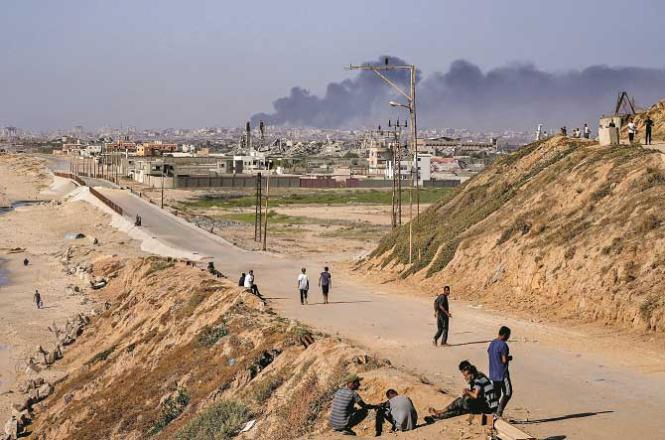 Smoke rises from an Israeli attack in the Gaza Strip. Photo: AP/PTI