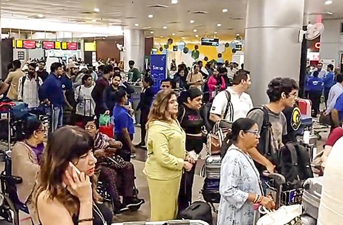 Passengers can be seen at Goa International Airport. Photo: PTI