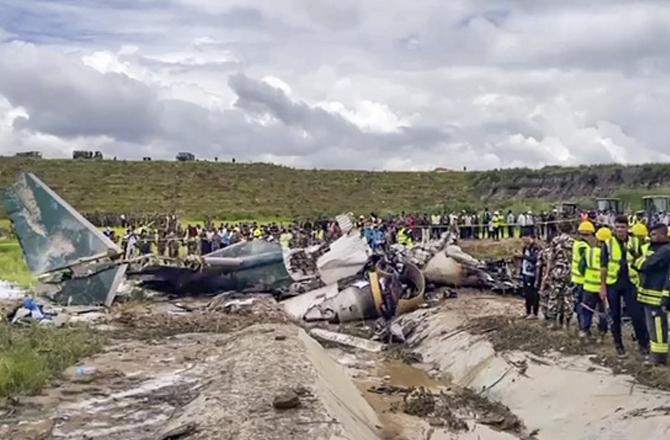 Wreckage can be seen at the airport. Photo: PTI