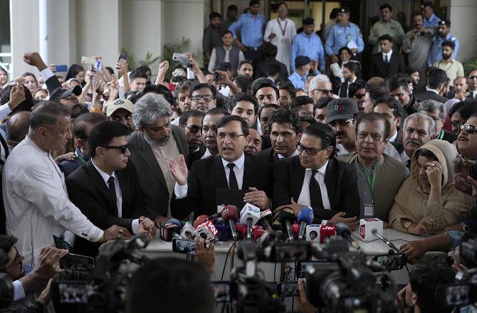 PTI Chairman Gauhar Khan addressing the media after the Supreme Court verdict. Photo: PTI