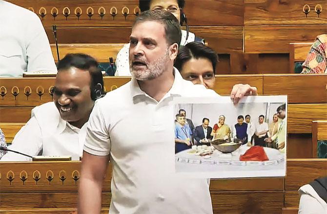 Rahul Gandhi showing a picture of preparing halwa before the budget in the Lok Sabha.  Photo: PTI