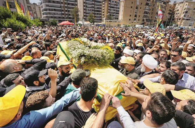 The scene of the funeral procession of the senior commander of Hezbollah, Talib Abdullah. Photo: PTI.