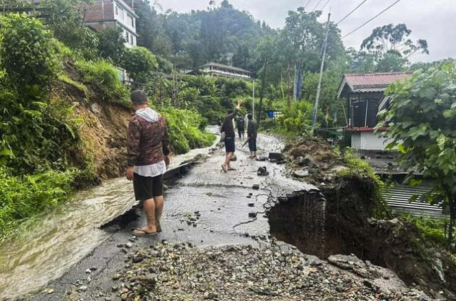 Mangan Section of a road damaged due to landslides triggered by incessant rainfall. Photo: Agency