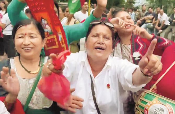 Supporters of Chief Minister Prem Singh Tamang`s party SKM are happy with the victory. Photo: PTI