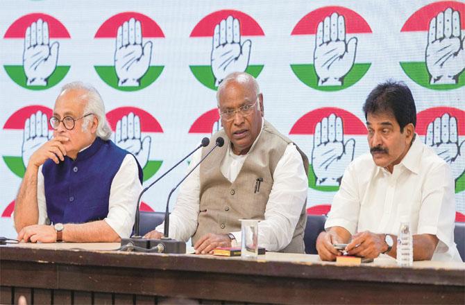 Congress president Mallikarjan Kharge, KC Venugopal and Jairam Ramesh during the press conference.(PTI)