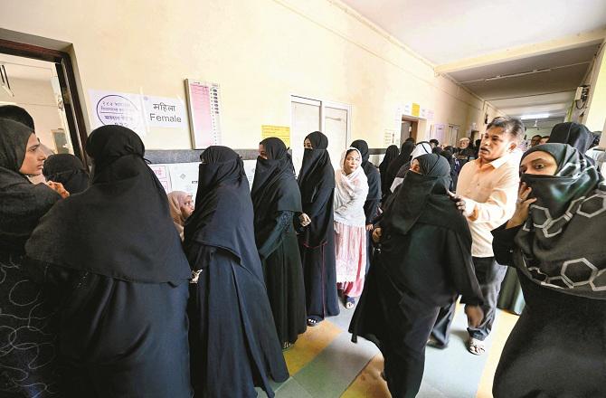 A queue of voters at a polling booth in Mumbai. Photo: PTI