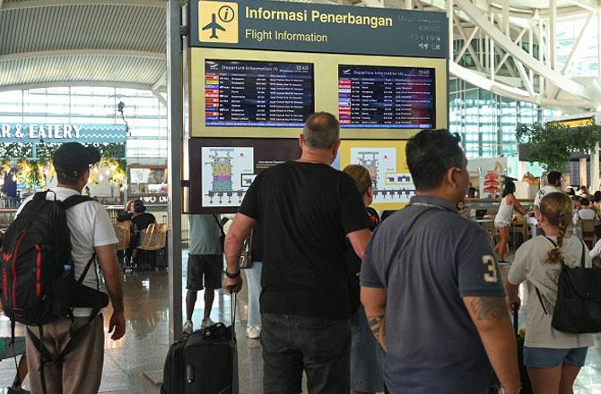 Passengers can be seen in distress at Bali airport. Photo: X