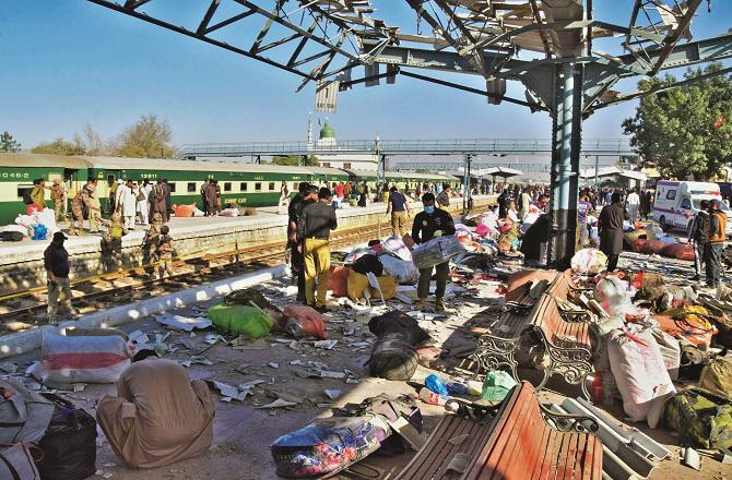 Scattered baggage of passengers can be seen at the railway station. Photo: PTI