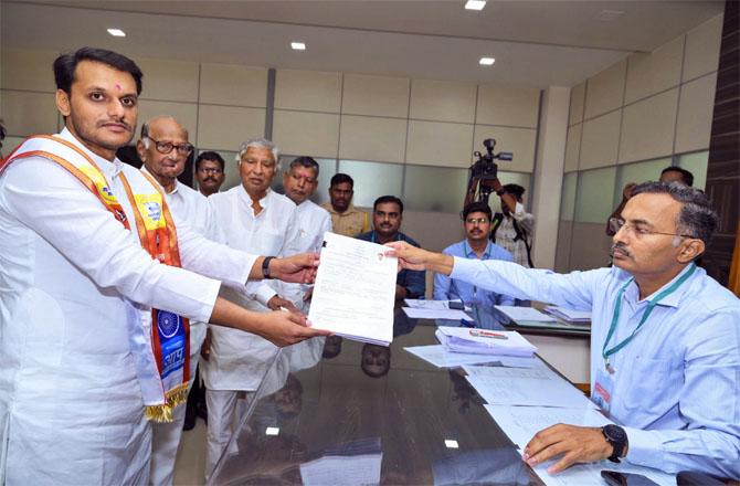 Sharad Pawar along with his grandson Yogendra Pawar were present at the form submission event (Photo: PTI)