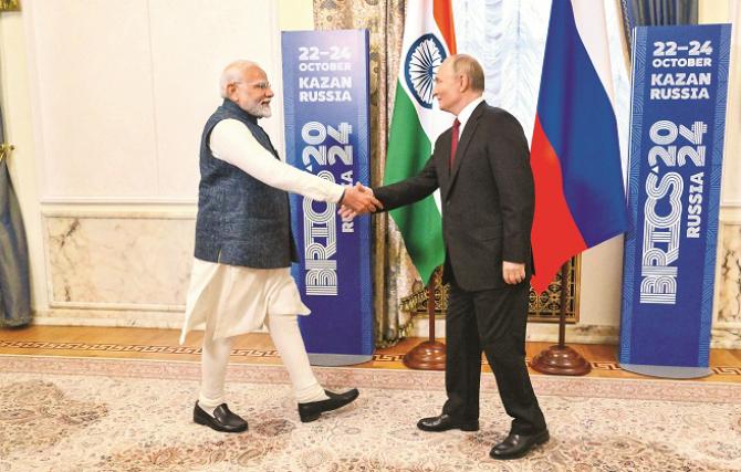 Russian President Vladimir Putin welcoming Prime Minister Modi in Kazan. Photo: PTI