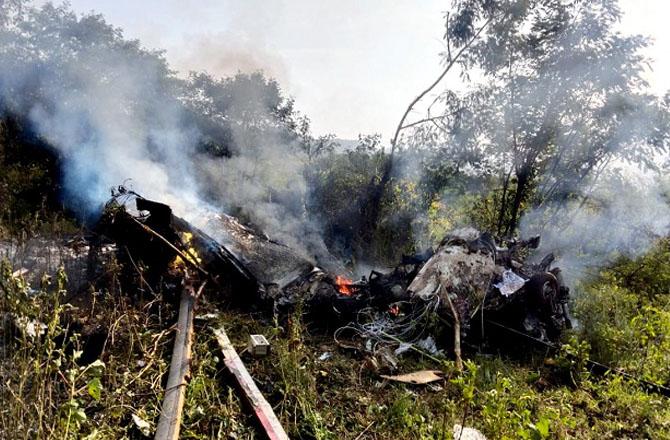 The remains of the helicopter can be seen. Photo: PTI