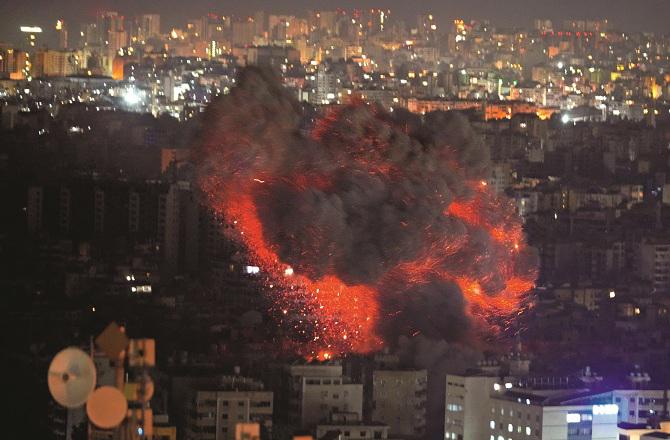 Flames and smoke can be seen after the Israeli attack on North Beirut. Photo: PTI.