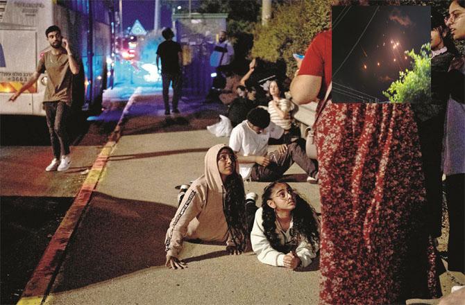 As soon as the sirens of attacks on Tel Aviv sounded, local people lay down on the streets. (Inset: Rain of missiles) (Photos: AP/PTI)