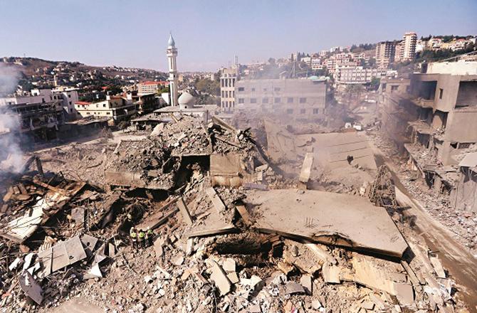 A destroyed area in Lebanon where a mosque is also visible. Photo: PTI.