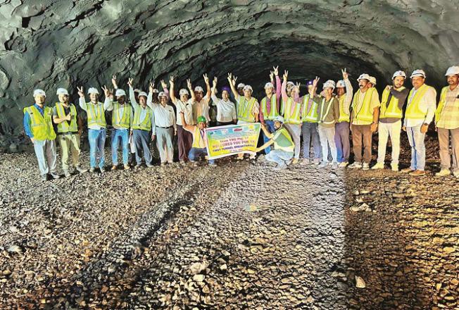 Engineers and workers are looking happy after building the tunnel. Photo: PTI