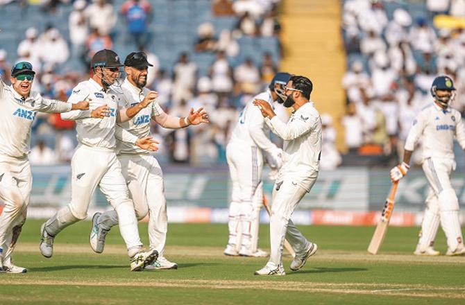 New Zealand players celebrate after their win against India. Photo: PTI.