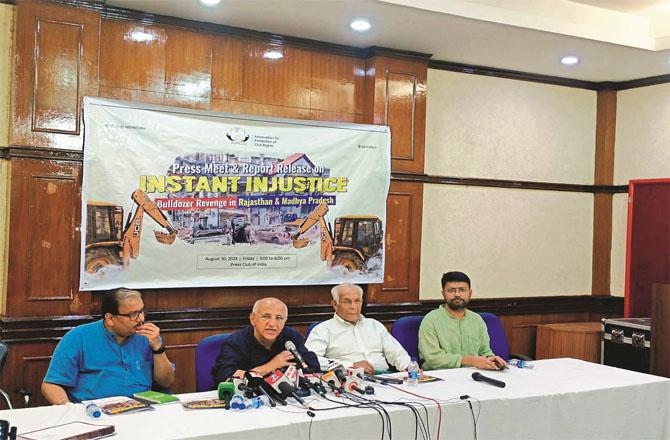 From right, APCR officials Nadeem Khan, Wajahat Habibullah, Harsh Mandir and Manoj Jha during the press conference.