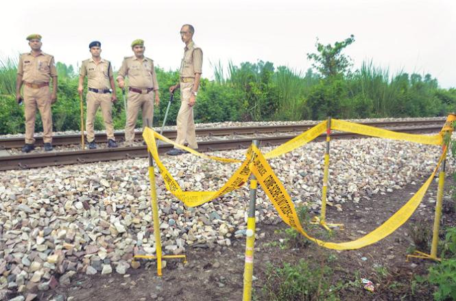 Security personnel are seen at the accident site in Kanpur. Photo: PTI