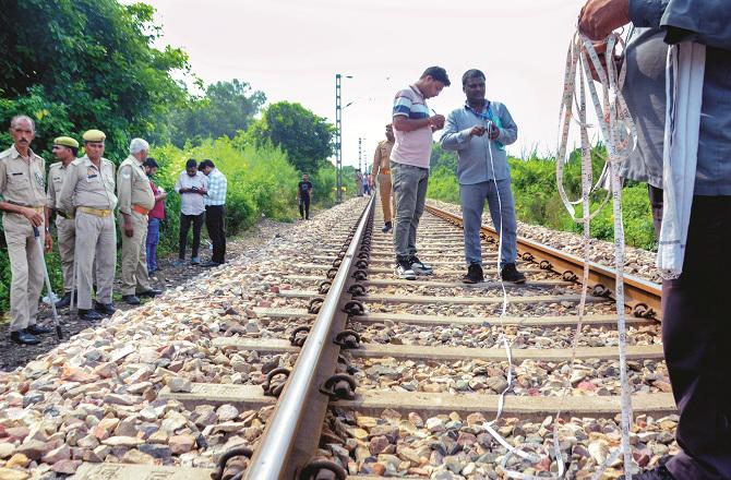 Officers engaged in investigation at the accident site in Kanpur. Photo: PTI