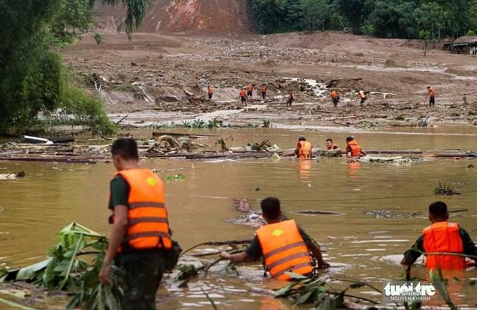 Aid workers assist people after floods in Lao Cai. Photo: X