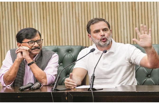 Supriya Sule, Rahul Gandhi and Sanjay Raut during the press conference. (Photo: PTI)