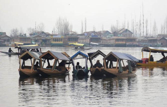 Tourists enjoying shikara ride at Dal Lake. Photo: PTI