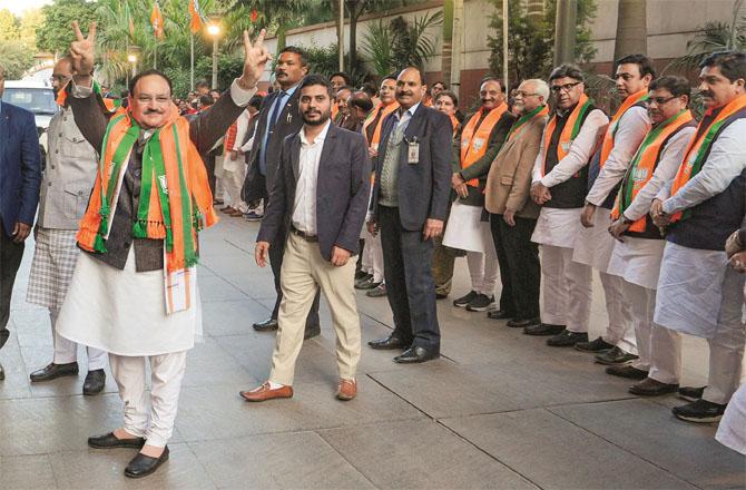 BJP president JP Nadda celebrates victory in Delhi with local BJP leaders. Photo: PTI