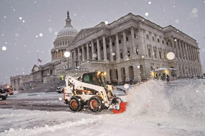 Snow removal continues in Washington. Photo: PTI