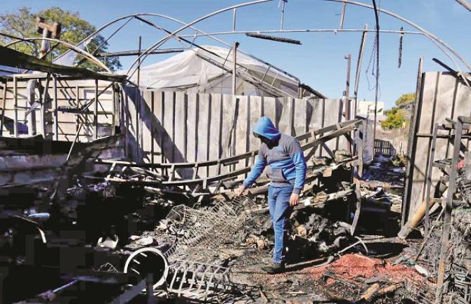 A man examines the rubble of his destroyed house after an Israeli attack in the West Bank. Photo: INN