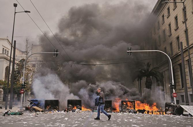 A scene from a violent protest in Athens. Photo: PTI.