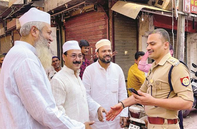 District SP Bishnoi meeting local Muslims after Friday prayers in Sambhal. (PTI)